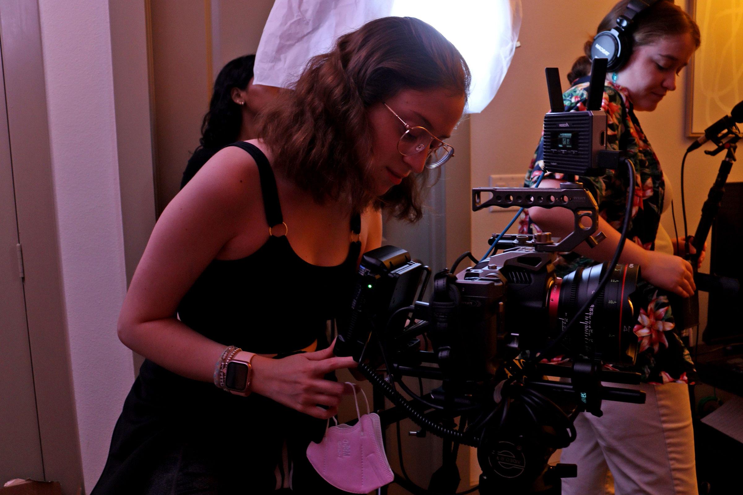 A crew member operates a camera on set of the new film, "Crossroads."