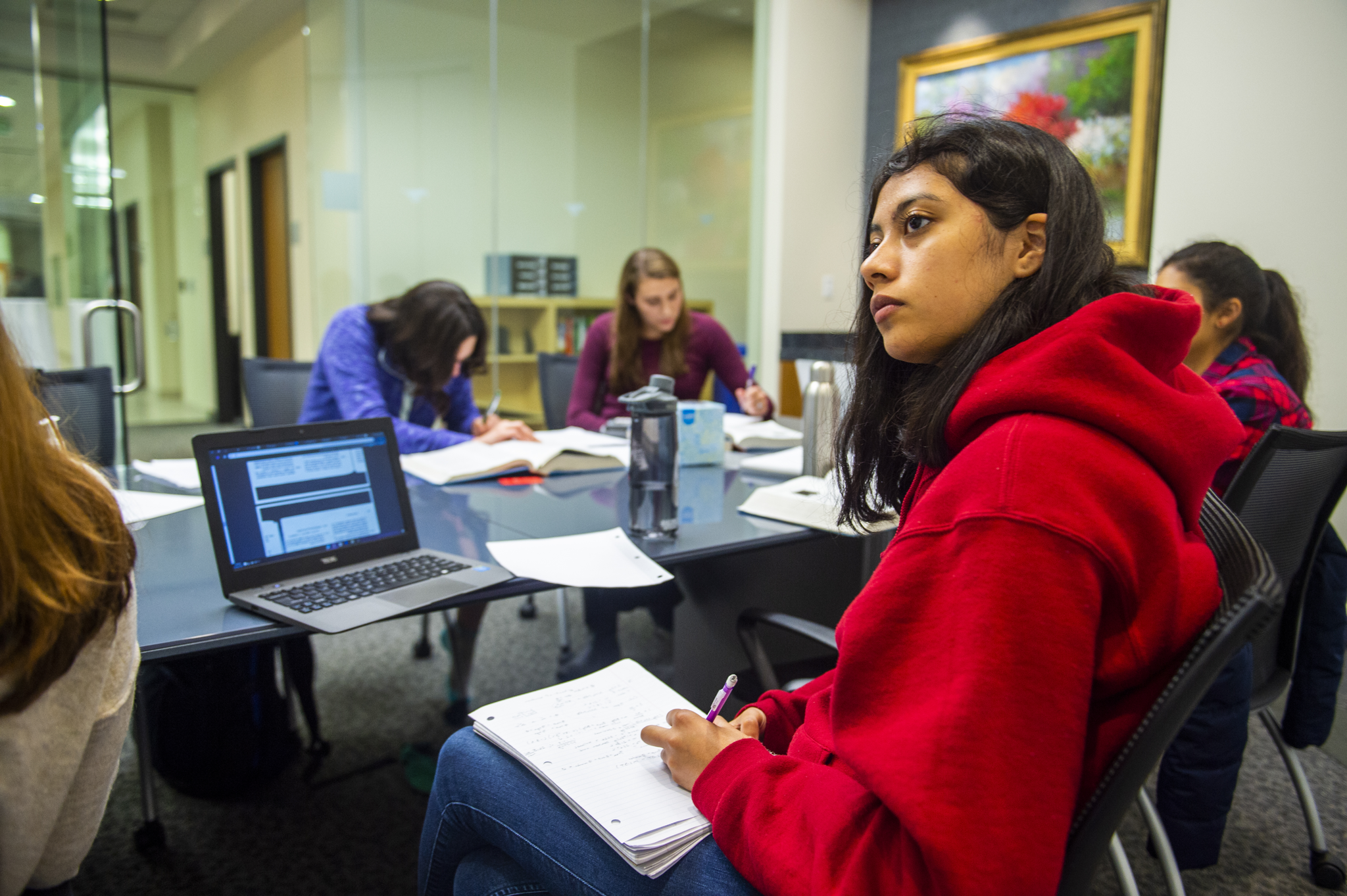 students listening at a table