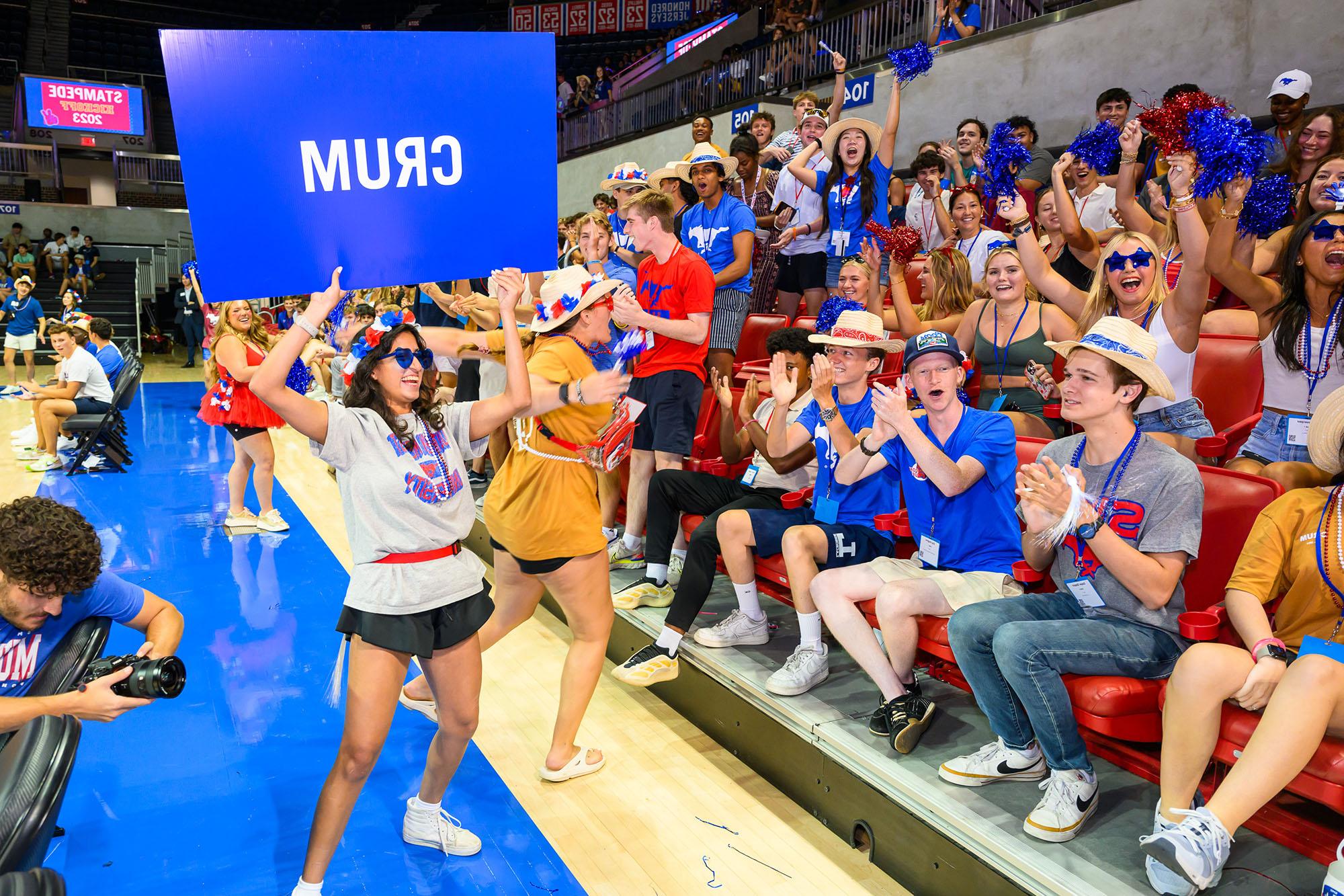 students in Crum Commons yelling for fun during stampede kickoff in moody coliseum